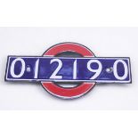 A London Underground enamel bullseye stocknumber identification plate, in the form of the iconic