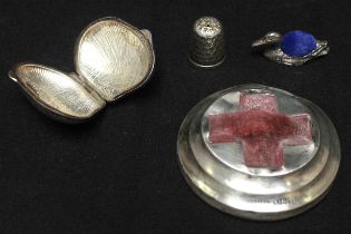 A WW1 period silver 'Red Cross' pin cushion, Birmingham, 1915, by S. Blackensee & Sons, together