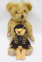 A 1960s jointed blonde mohair teddy bear, with amber and black glass eyes and black vertically