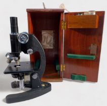 A vintage Cooke, Troughton & Simms Ltd York, England, monocular microscope with black lacquered body