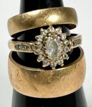 Two 9ct gold wedding rings, together with a 9ct gold dress ring, set with white faceted stones in