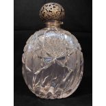 A late Victorian silver-mounted large cut-glass perfume bottle, of compressed blobular form, with