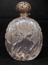 A late Victorian silver-mounted large cut-glass perfume bottle, of compressed blobular form, with