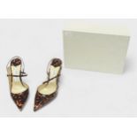 A pair of Jimmy Choo cognac patent leather high heel shoes, with applied gilt ‘JC’ monogram to side,