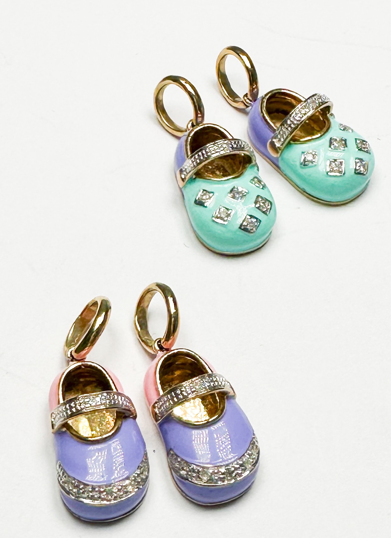 Two pairs of 9ct yellow gold and enamel shoe charms, set with small diamonds, total weight 11.0