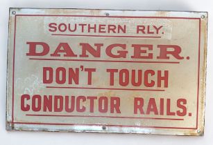 A Southern Railway enamel sign, red text to white ground, ‘Southern Rly. DANGER. Don’t Touch