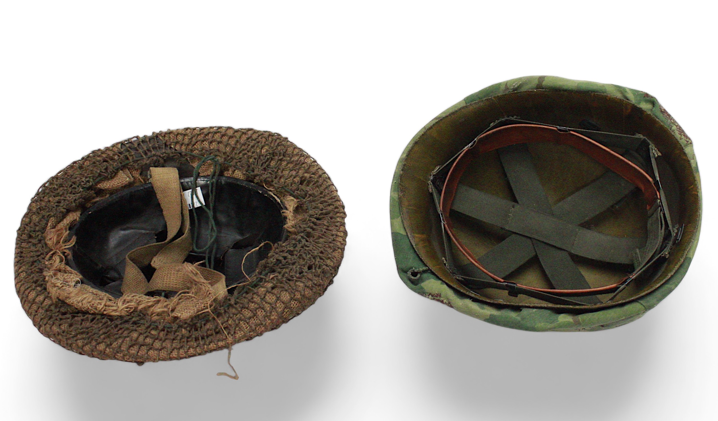 A WWII British Brodie helmet with sack and net covering, original black vinyl liner and webbing - Image 2 of 2