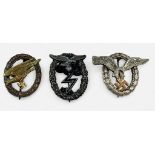 Three German Third Reich Luftwaffe badges including Pilots badge, Ground Assault badge,