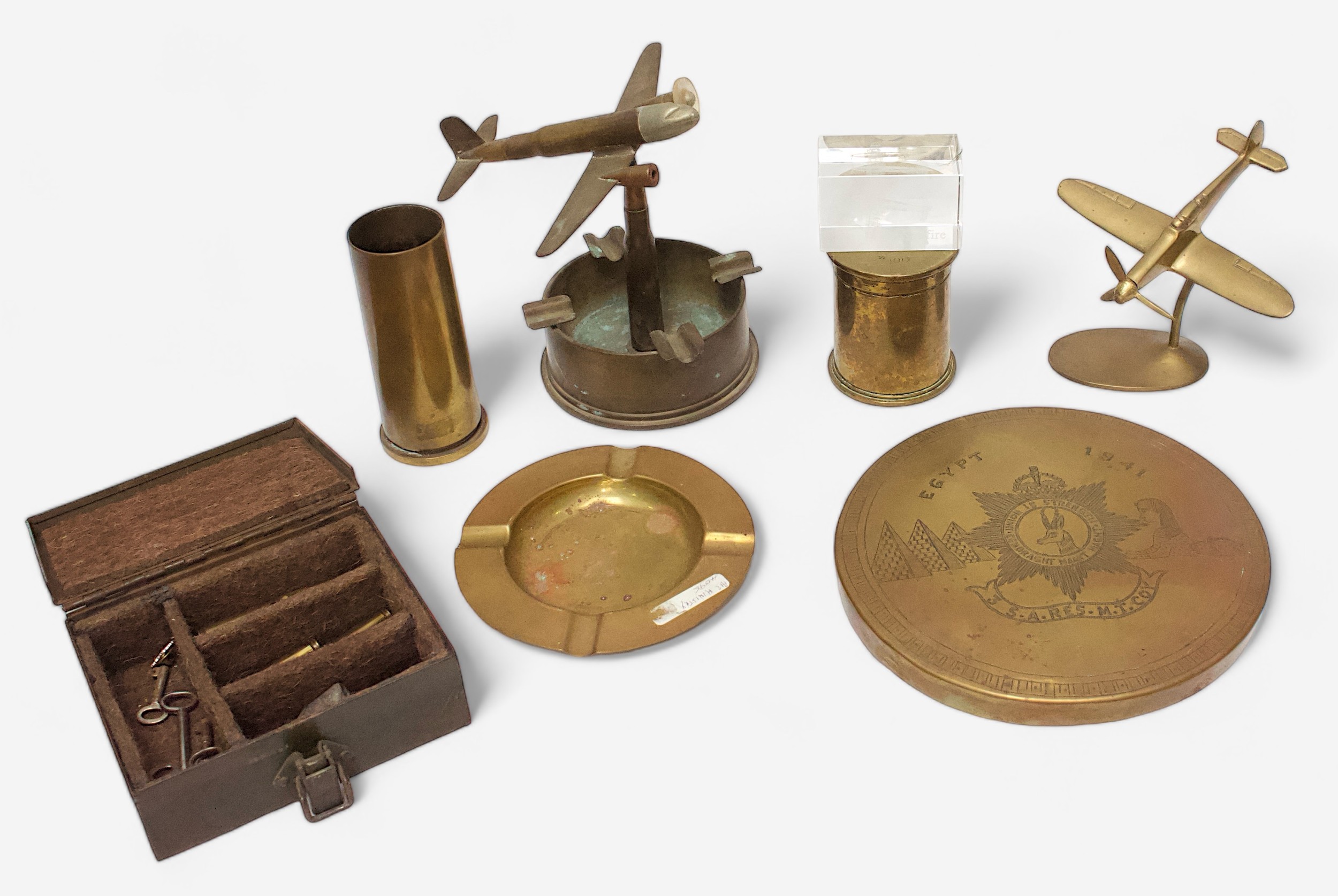 A small collection of assorted WWI and WWII trench art items including ashtrays, vases and ornaments