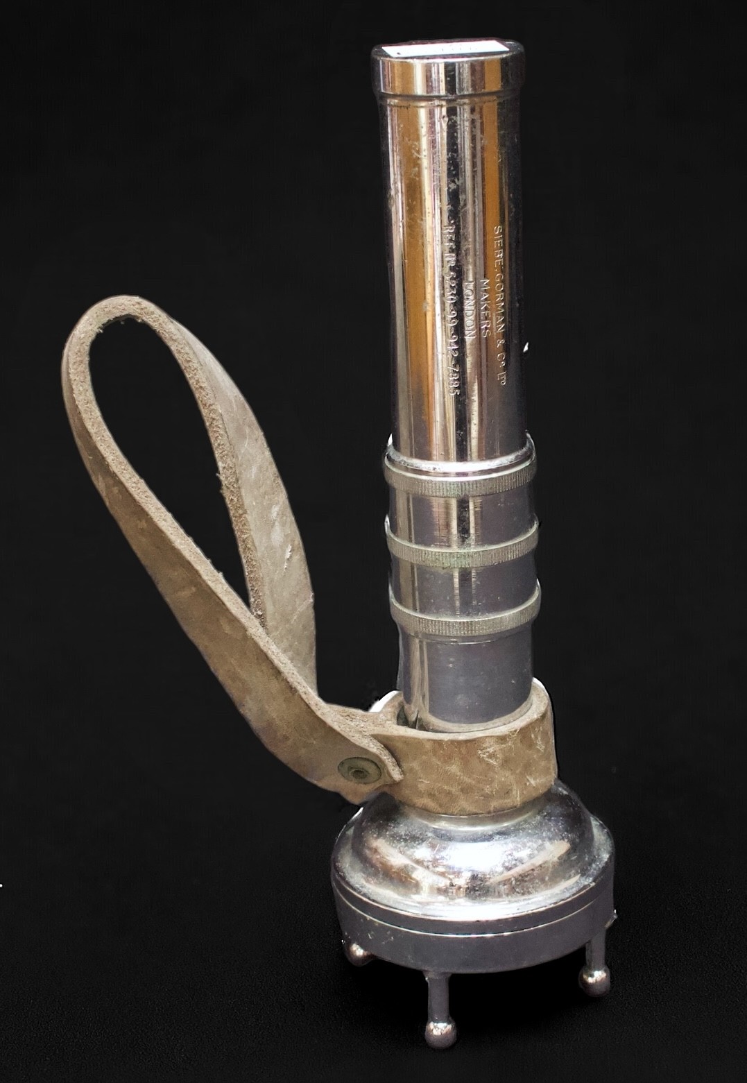 A chromium-plated four-pronged diving torch by Siebe Gorman & Co Ltd, with leather lanyard, 28cm