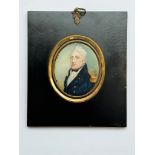 An early 19th century oval portrait miniature of a middle-aged Naval officer, with quiffed grey