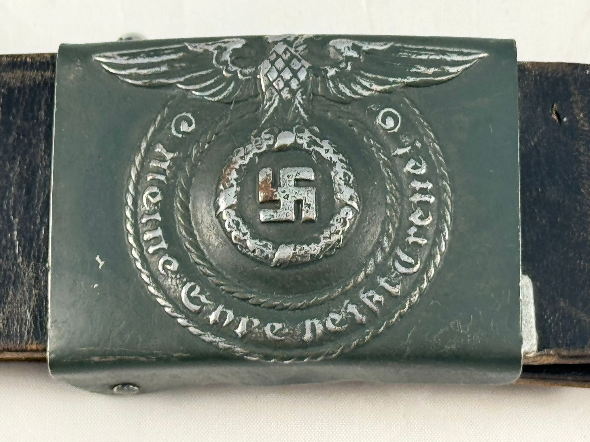 A German Third Reich Waffen SS Belt Buckle, with black leather belt, matt green painted buckle, - Image 2 of 2