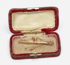 A 9ct gold sweetheart brooch modelled as a British C-Class submarine, engraved ‘C32’ to the side,