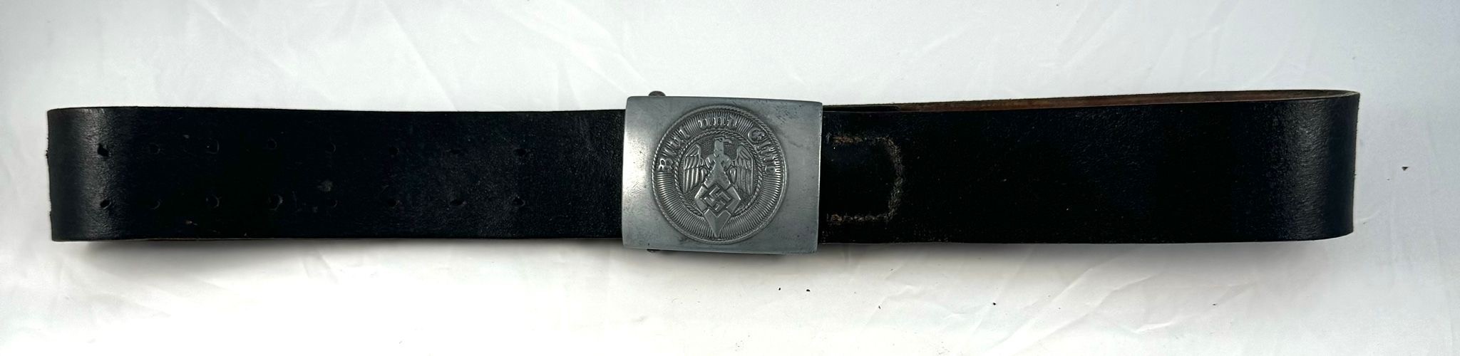 A Hitler Youth/ Hitler Jugend Leader's Buckle and leather belt, the buckle cast alloy, reverse