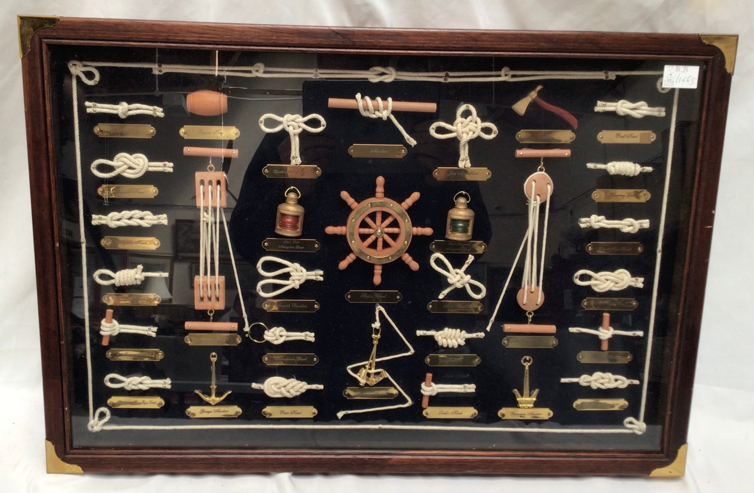 Two framed montages depicting examples of nautical knots, with annotated brass plaques, in brass
