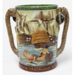 A Royal Doulton loving cup, 'Nelson’, designed by Charles Noke and Harry Fenton, with inscriptions '