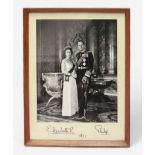 A signed monochrome photograph of Queen Elizabeth II and The Duke of Edinburgh, 1971, presented to