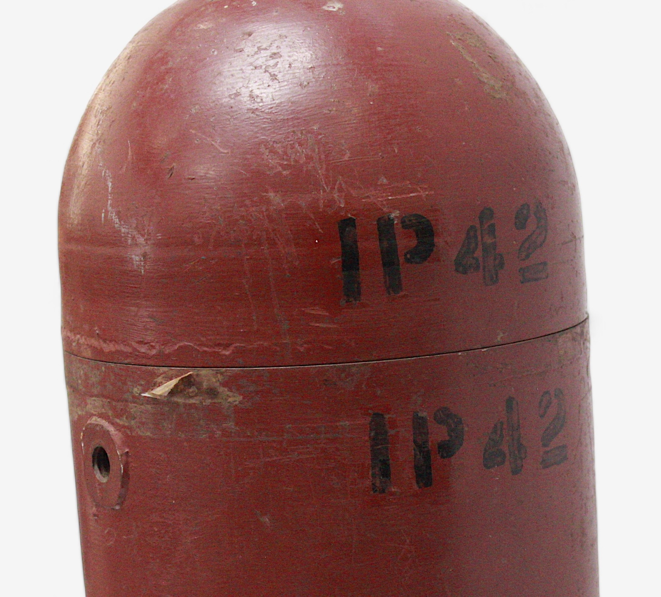 A large WWII aerial 'Practice Bomb,' outer casing painted red, marked ‘IP42’, with brass four- - Image 3 of 3