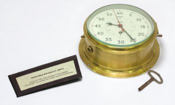 A WWII Smiths Astral brass cased military ship’s bulkhead clock, AP160174, the white painted with