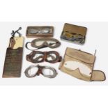 A collection of WWII goggles including RAF MKVIII Flying Goggles, Polaroid All-Purpose Goggle Kit
