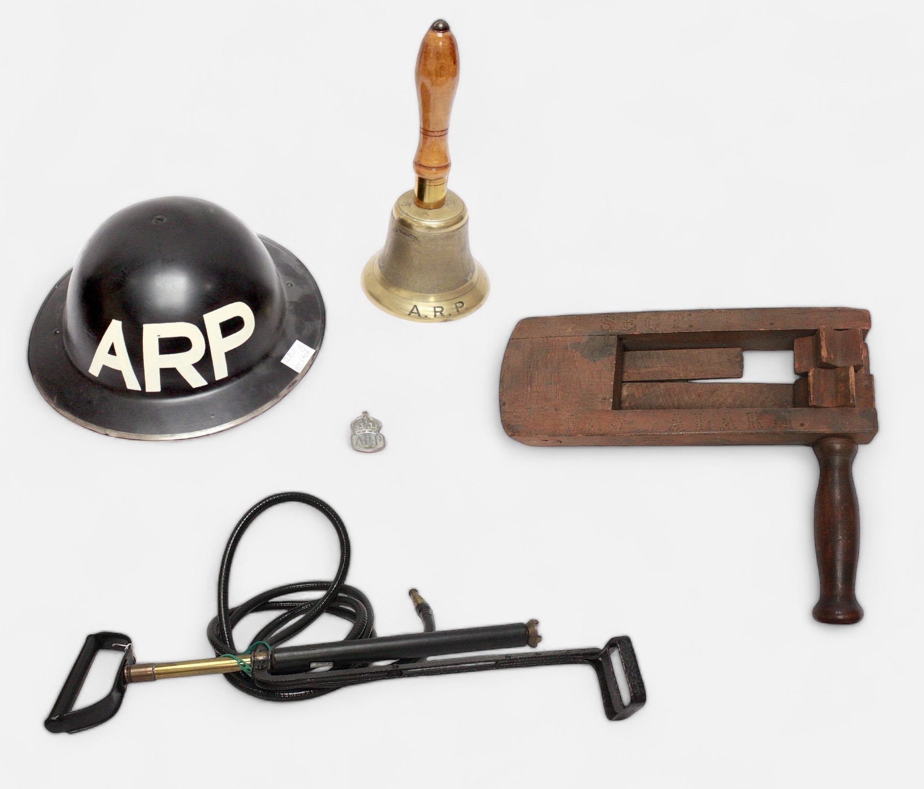 A WW2 Air Raid Precaution handbell, wooden gas alarm stamped 'A.R.P. W. CLEMENTS & Sons, 1939,'