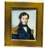 A Mid-19th century rectangular portrait miniature of a Naval Commander, with black curly hair and