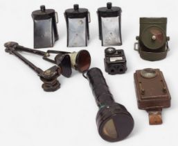 A collection of assorted WWII lamps, comprising three Air Raid Precautions (A.R.P.) lamps with