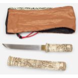 A Meiji Period (1868-1912) Japanese Tanto Knife, relief carved bone handle and scabbard decorated