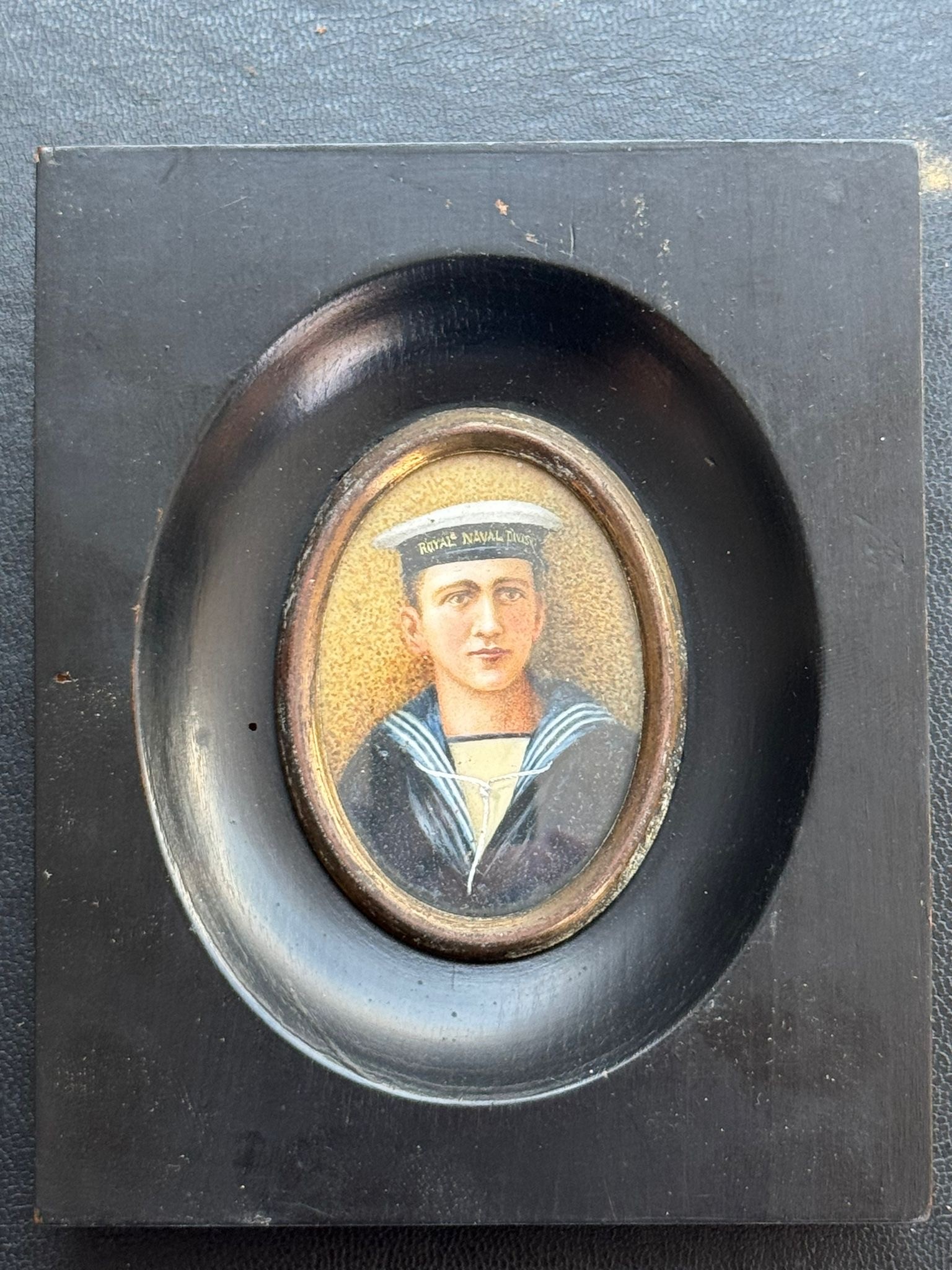 An early 20th century oval portrait miniature, inscribed in pencil verso, ‘Geoffrey Charles