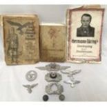 A small collection of assorted WWII German collectables including a Panzerarmee Afrika Calender