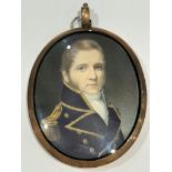 A Mid-19th century oval locket-back portrait miniature of a middle-aged senior Naval officer, with