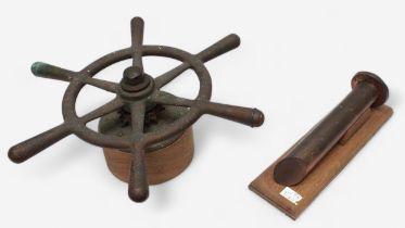 A large copper rivet, with multiple broad arrow stamps and mounted on fitted wooden stand, 33cm long