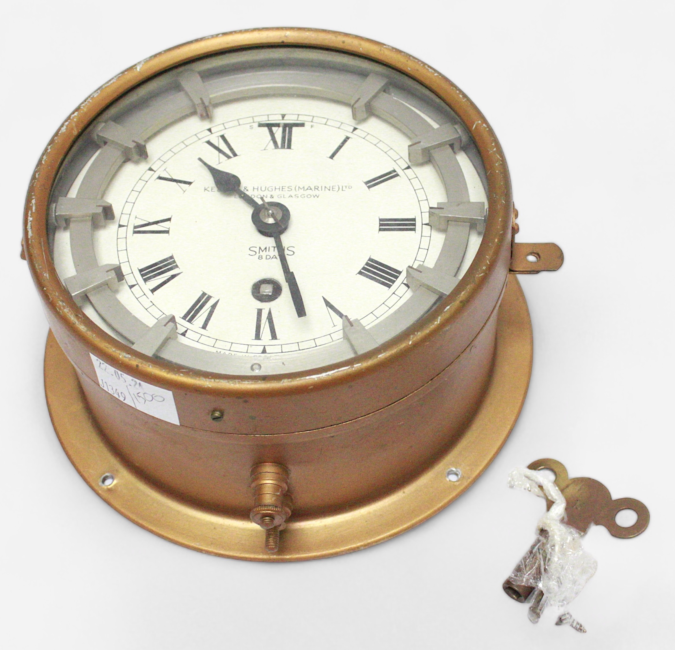 A zig-zag convoy 8-day bulkhead clock by Kelvin Hughes (Marine) Ltd, dial secondary stamped Smiths 8