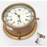 A zig-zag convoy 8-day bulkhead clock by Kelvin Hughes (Marine) Ltd, dial secondary stamped Smiths 8