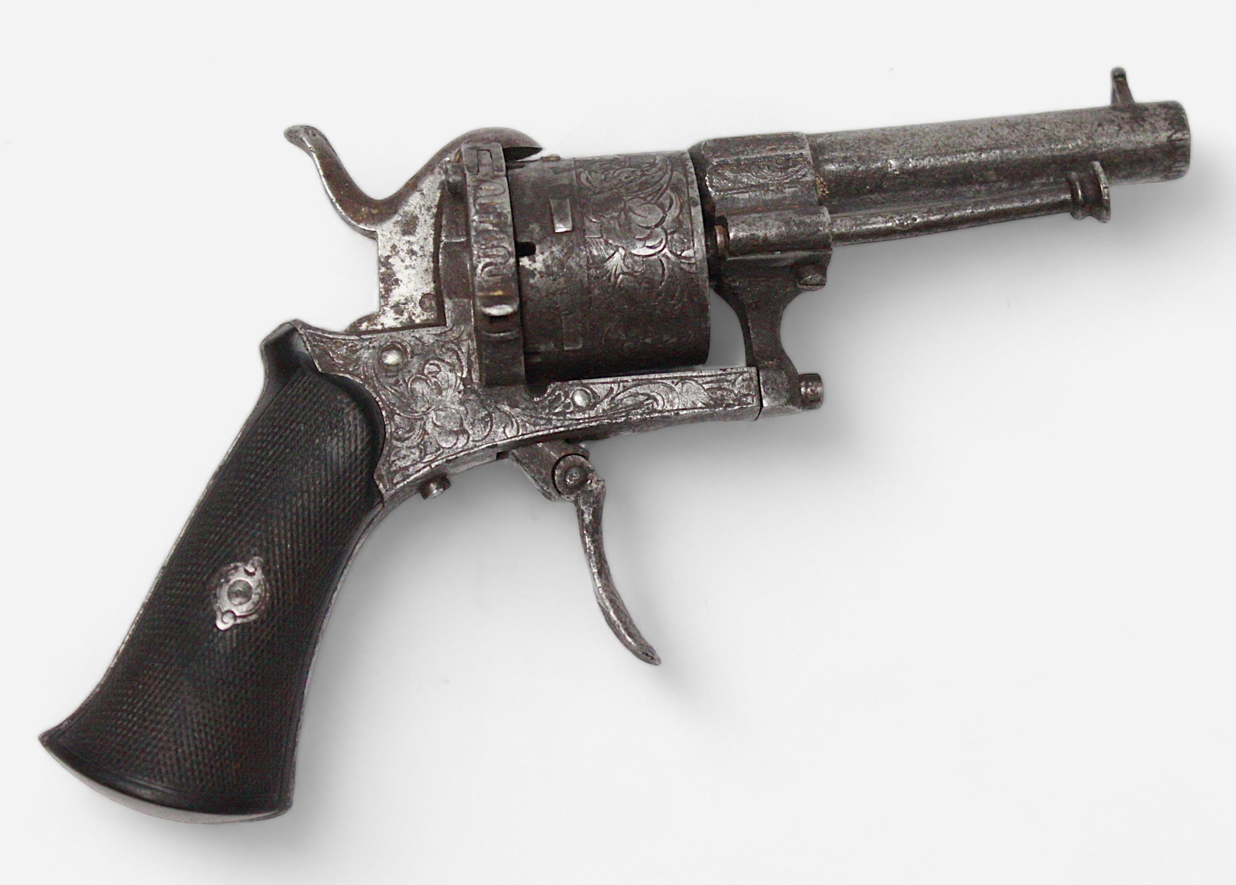 A Belgian pinfire pocket revolver, with all over scrolled foliate engraving and stained wooden grip,