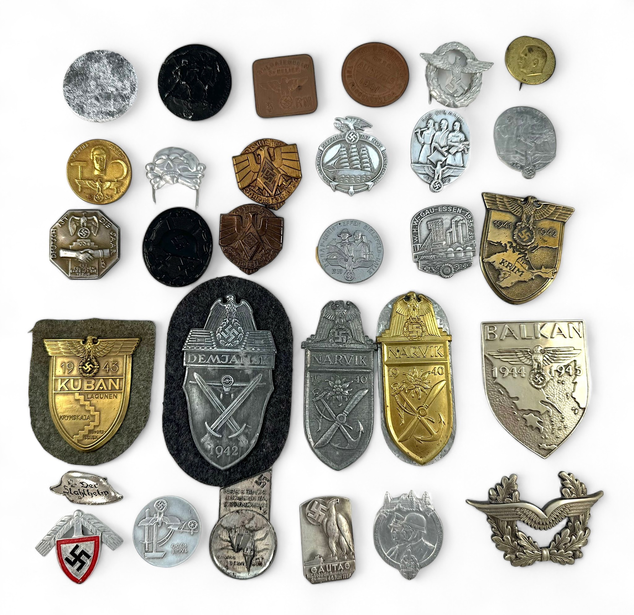 Thirty various German Third Reich badges, various divisions, campaigns etc.