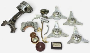 A collection WWII parts, an engine piston removed from a Junkers aircraft, main bearing cap from