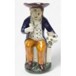 A Prattware Pottery ‘Sailor’ toby jug, c1790-1810, with blue coat and floral painted waistcoat and