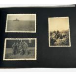 A WWII German Third Reich photogrpah album, the front cover embossed with the Reichsadler and the