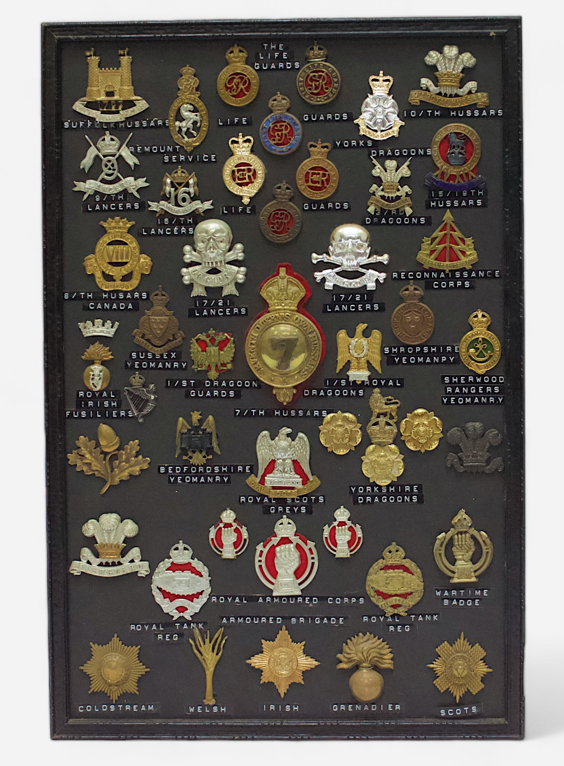 Approximately 46 various cap badges, including Guards, Hussars, Fusiliers, Dragoons, Yeomanry,