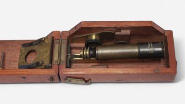 A small monocular travelling microscope by J. H. Steward, Strand, London, with spare lens, housed in