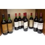 A collection of nine bottles of assorted vintage red wine, comprising two bottles of Chateau Picon