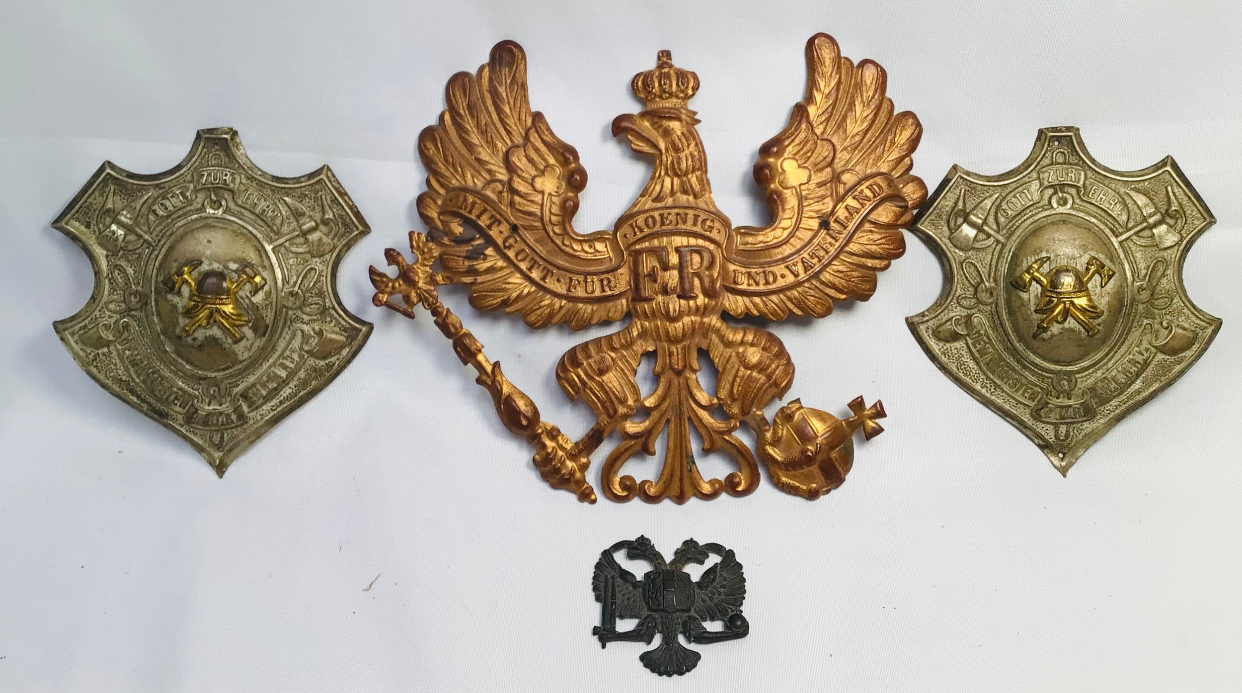 A Prussian Imperial German Infantry Officer’s Pickelhaube helmet brass plate, together with a pair - Image 2 of 6