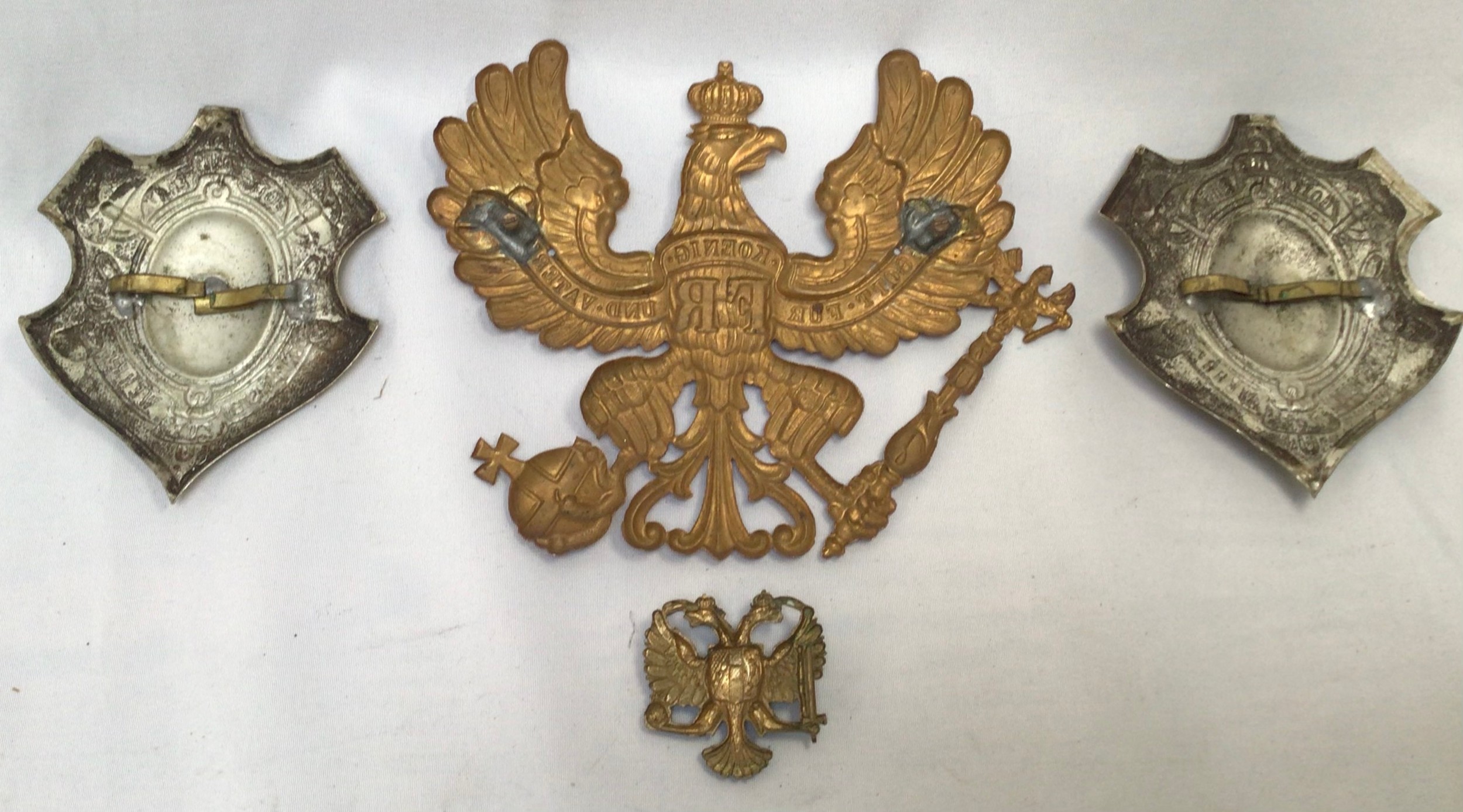 A Prussian Imperial German Infantry Officer’s Pickelhaube helmet brass plate, together with a pair - Image 3 of 6
