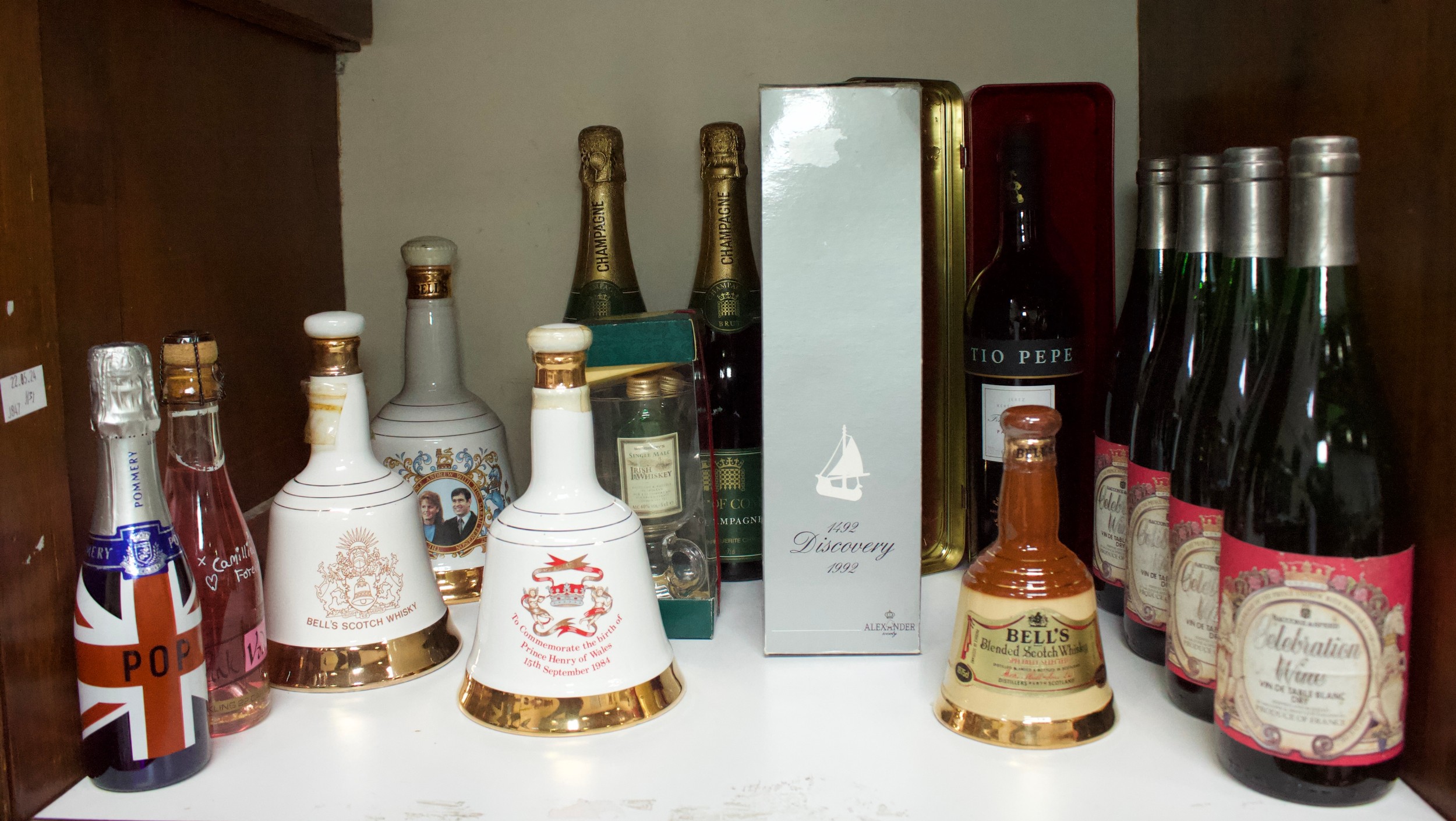 A collection of assorted wines and spirits, comprising various Bell’s Whisky Wade decanters, ‘The