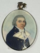 An early 19th century oval locket-back portrait miniature of a Naval officer, with shoulder-length