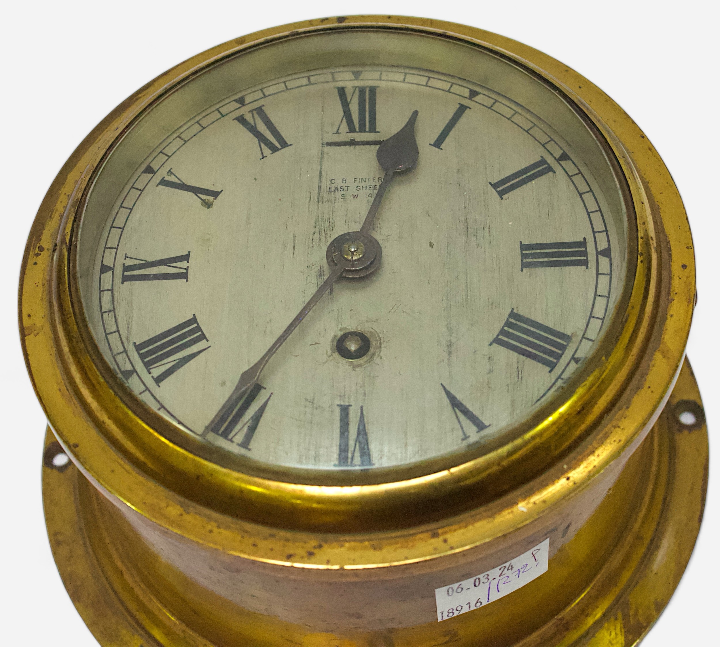 A brass cased ships bulkhead clock, the silvered dial with Roman numerals denoting hours and - Image 2 of 2