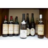 A collection of thirteen assorted bottles of vintage wine including three bottles of 1990 Chateau