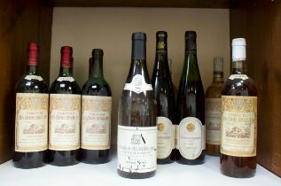 A collection of thirteen assorted bottles of vintage wine including three bottles of 1990 Chateau