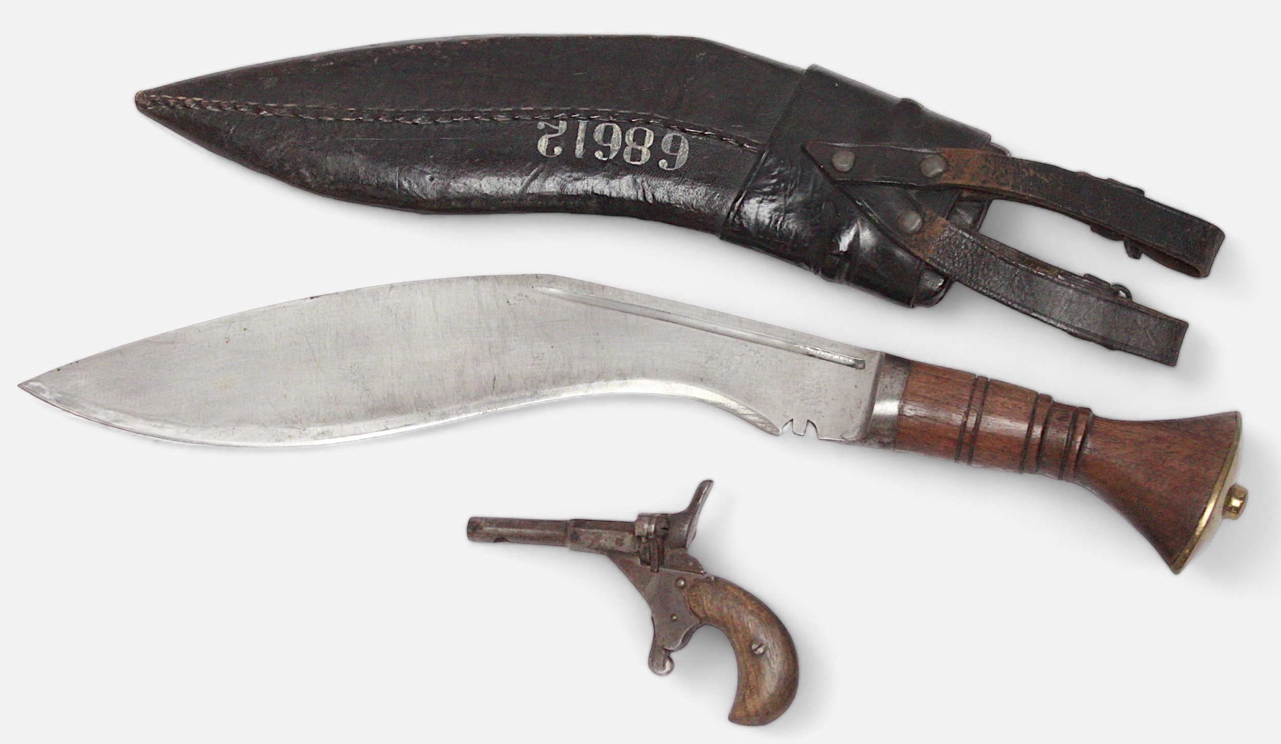 A Kukri knife with carved wooden grip and leather scabbard with illustration to side and numbered - Image 2 of 2